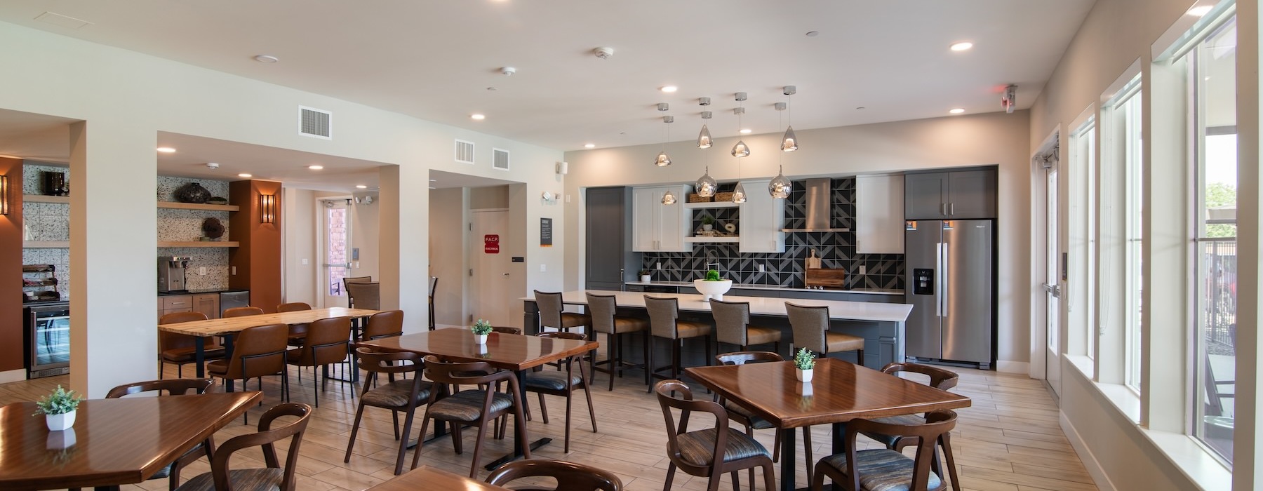 a clubroom with tables and chairs