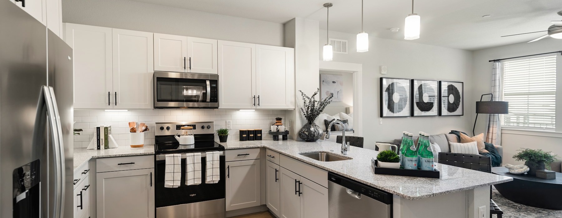 a kitchen with white cabinets