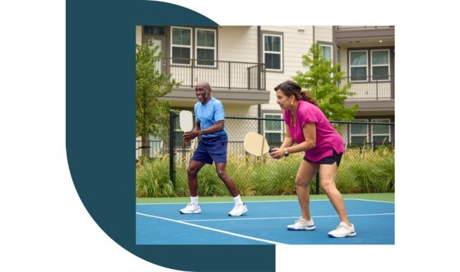 Get your workout on a couple of people play pickleball