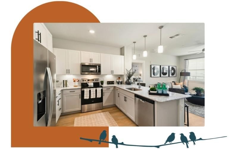 a kitchen with white cabinets